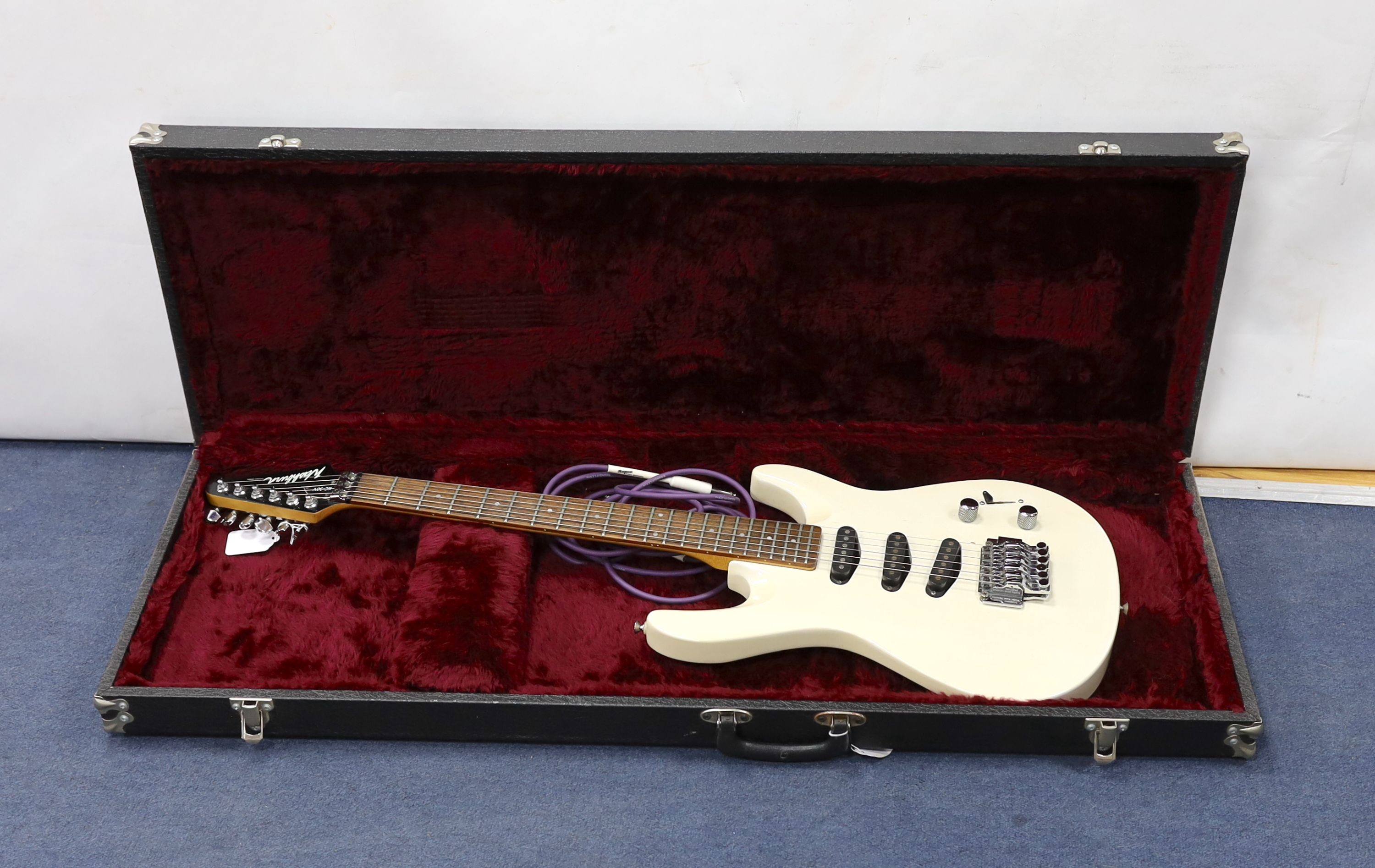 A Washburn KC-30v electric guitar in hard case